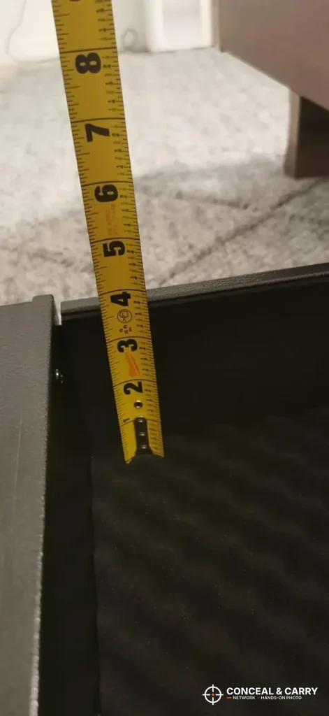 Tape measure standing in the Langger under-bed safe to check the inside height