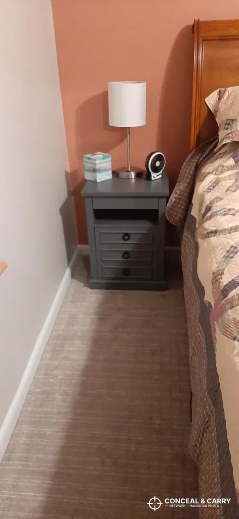 Lvifur nightstand next to a bed in a bedroom corner