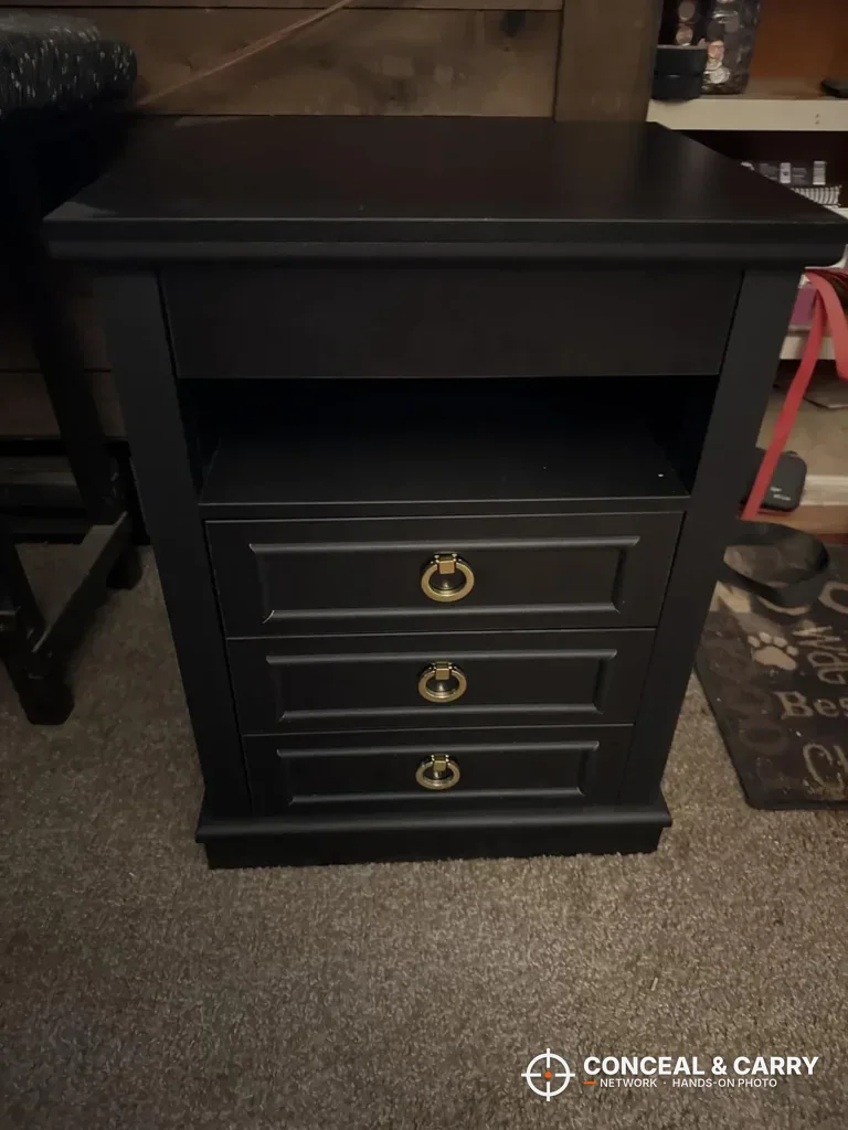 Lvifur nightstand gun safe standing on carpet, front view with the open shelf and three drawers