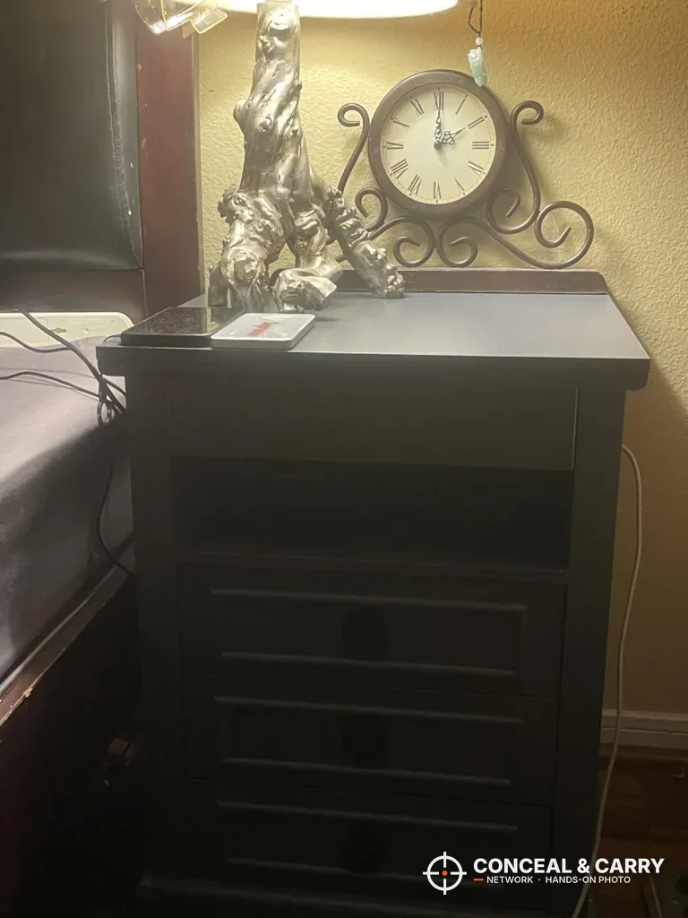 Lvifur nightstand beside a bed with a lamp and clock on top