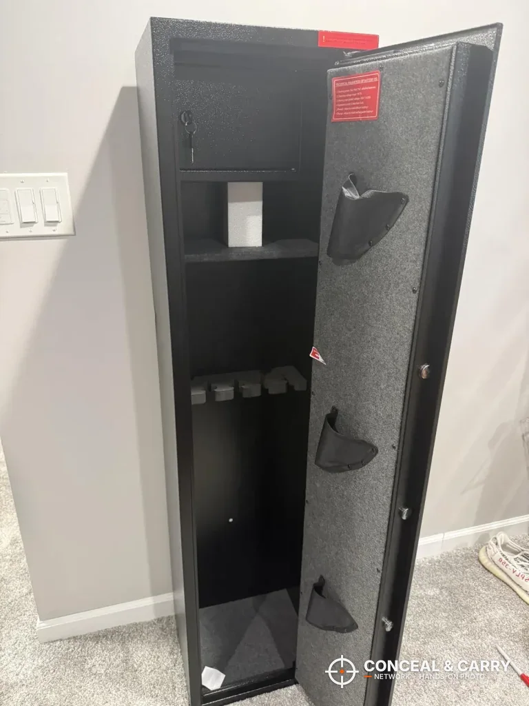 Marcree 8-10 door open with pistol pockets on the door and the shelf and rack inside