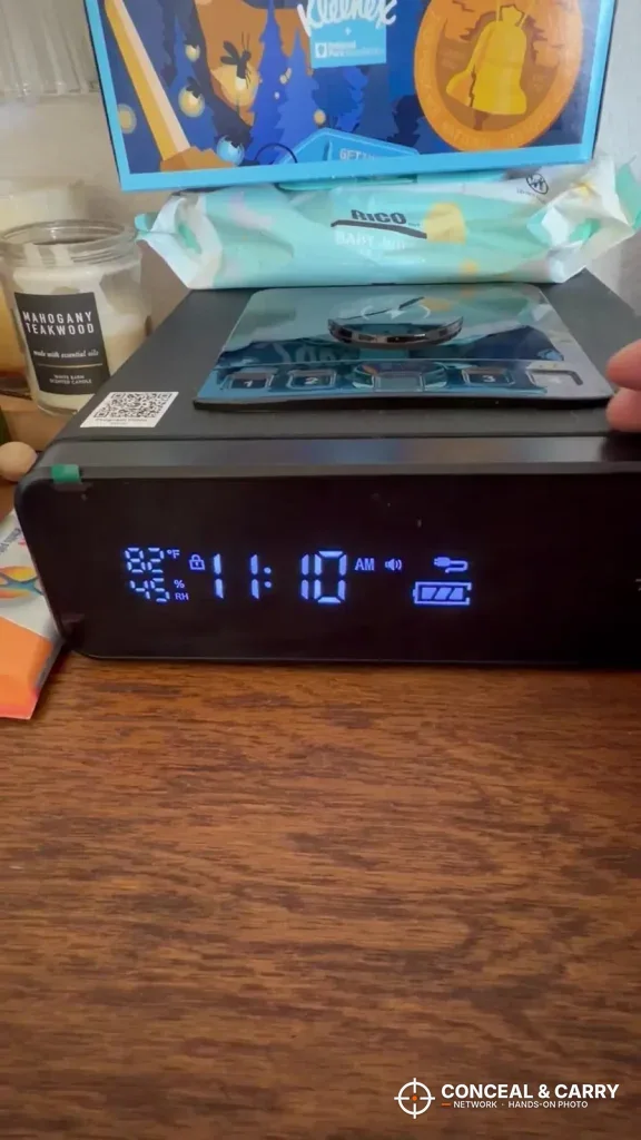 Mboko safe on a wooden table with the clock display lit