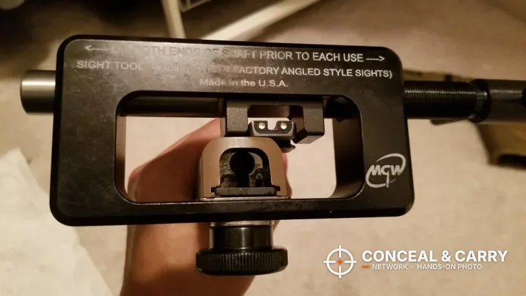 MGW Glock sight tool frame with a slide clamped and the rear sight showing through the window
