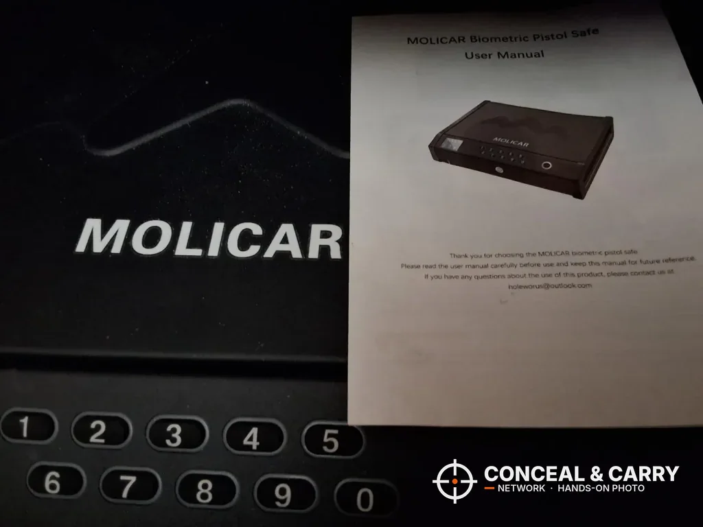 MOLICAR bedside safe keypad with the user manual laid on the lid