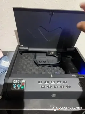 Handgun lying on the foam inside the open MOLICAR bedside safe