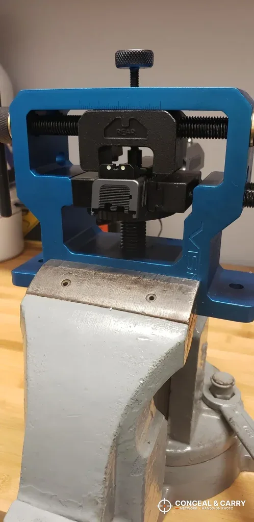 NcSTAR VISM sight tool held in a bench vise