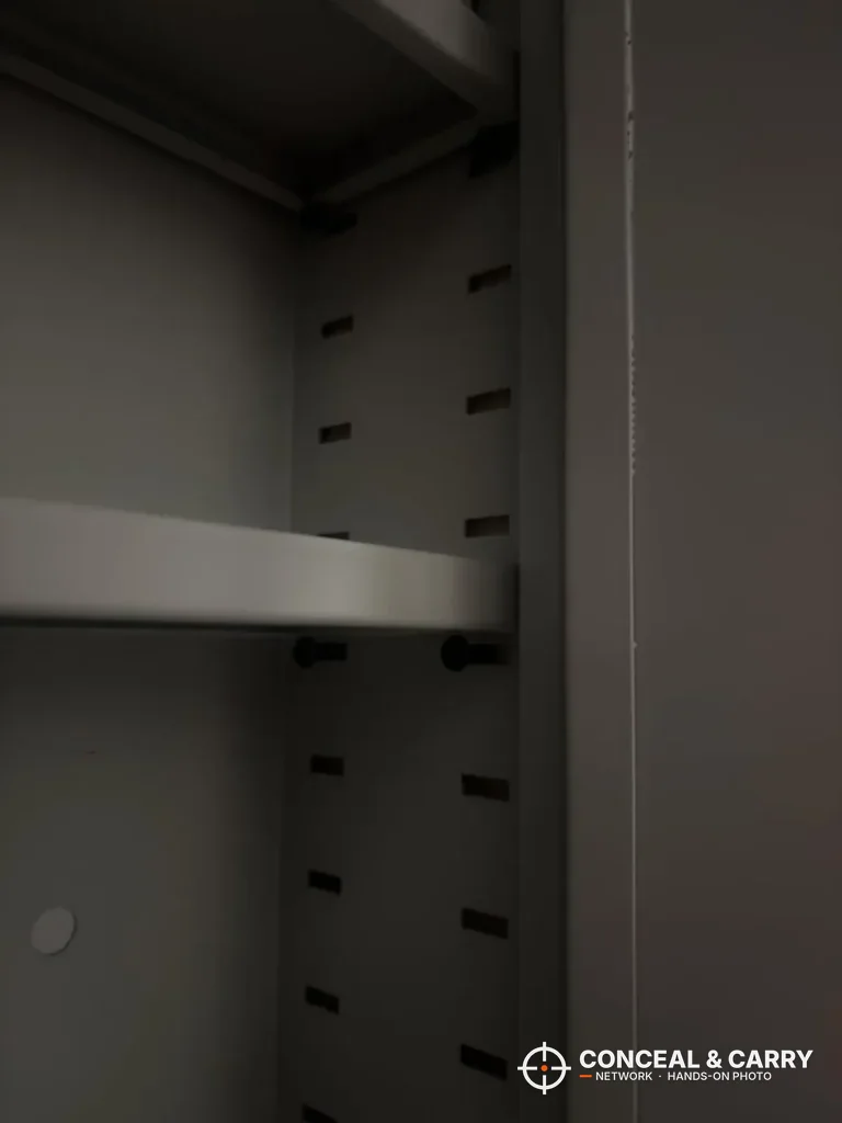 Adjustable shelf and slotted side rail inside the Omethey in-wall safe
