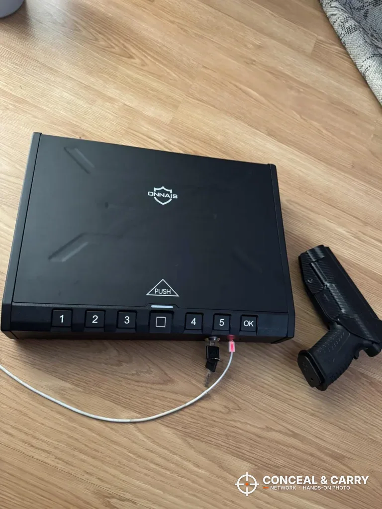 ONNAIS Iron Pro with a cable plugged into the front port, pistol beside it