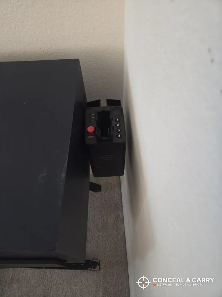 ONNAIS open-design safe mounted on the side of a black cabinet