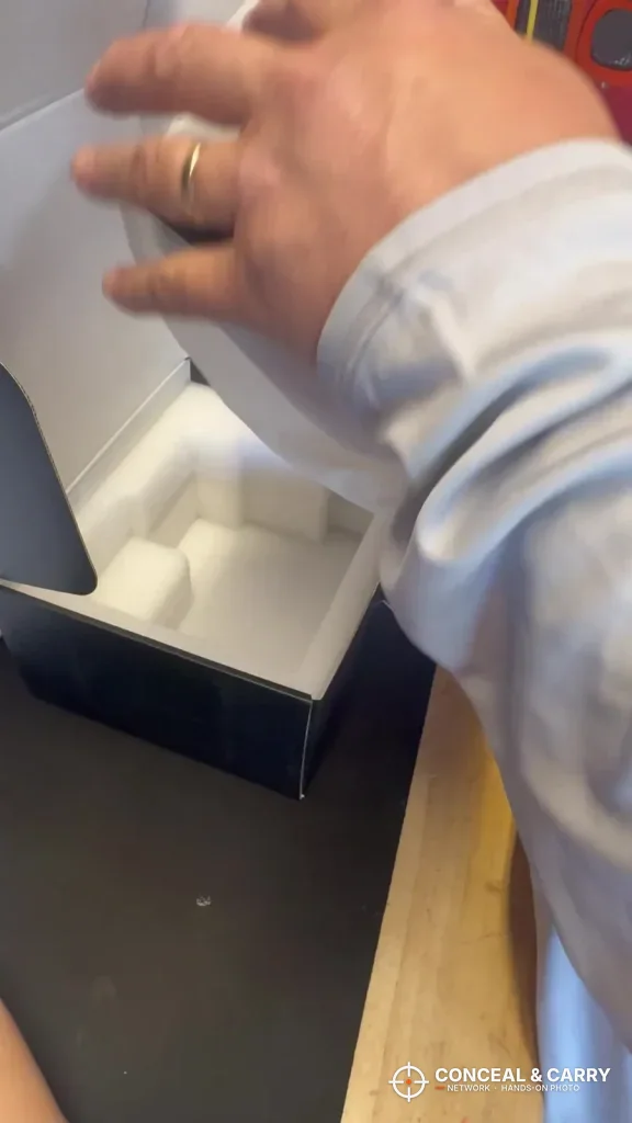 Unboxing the ONNAIS open-design pistol safe from its foam insert