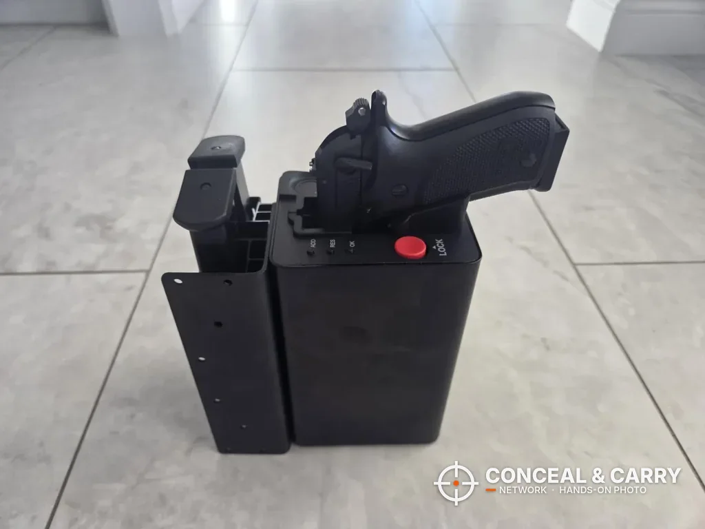 ONNAIS open-design safe with its side mounting plate and a pistol seated