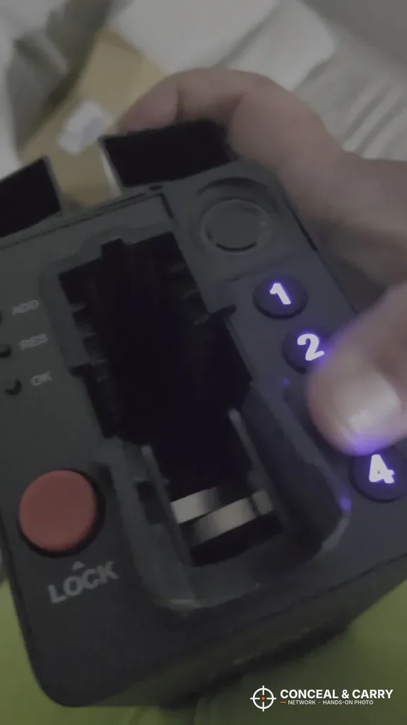 Finger pressing the lit keypad buttons on the ONNAIS open-design safe