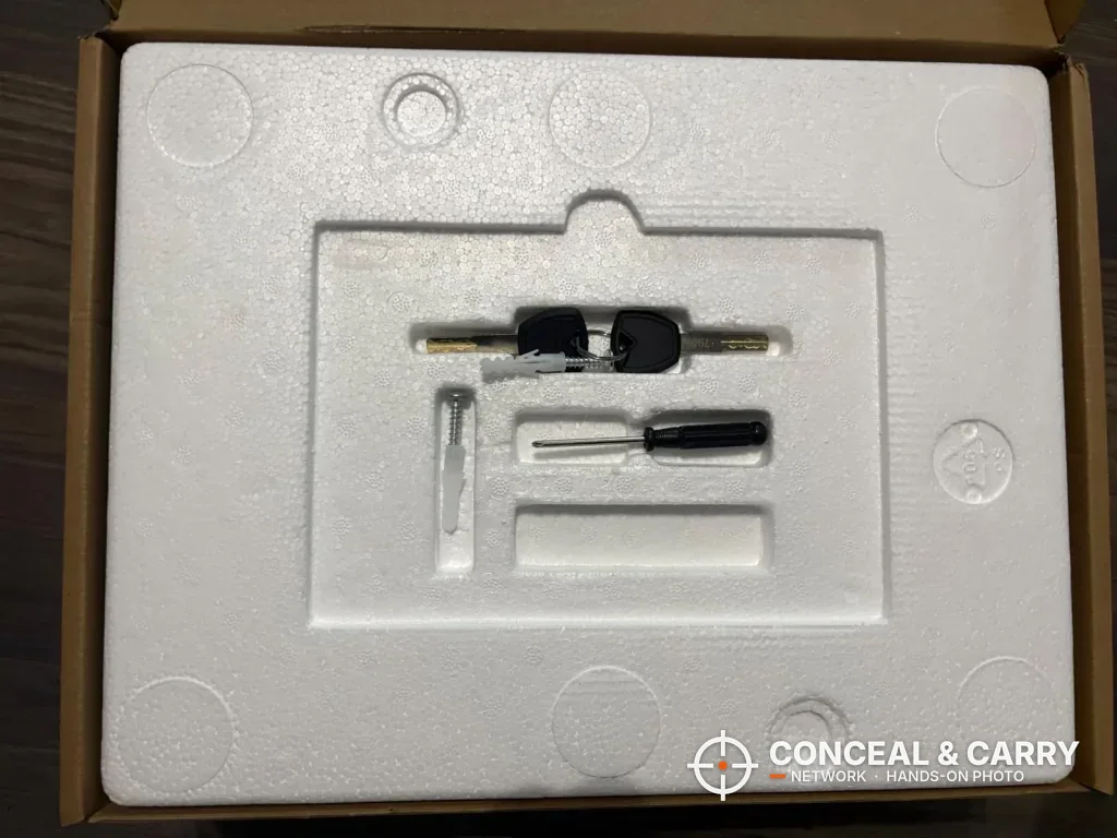 Two ORARAER backup keys and a small screwdriver packed in the foam insert