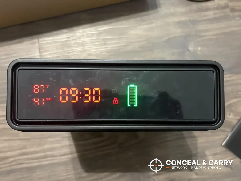 ORARAER safe front display showing the clock, small readings, lock symbol and battery icon