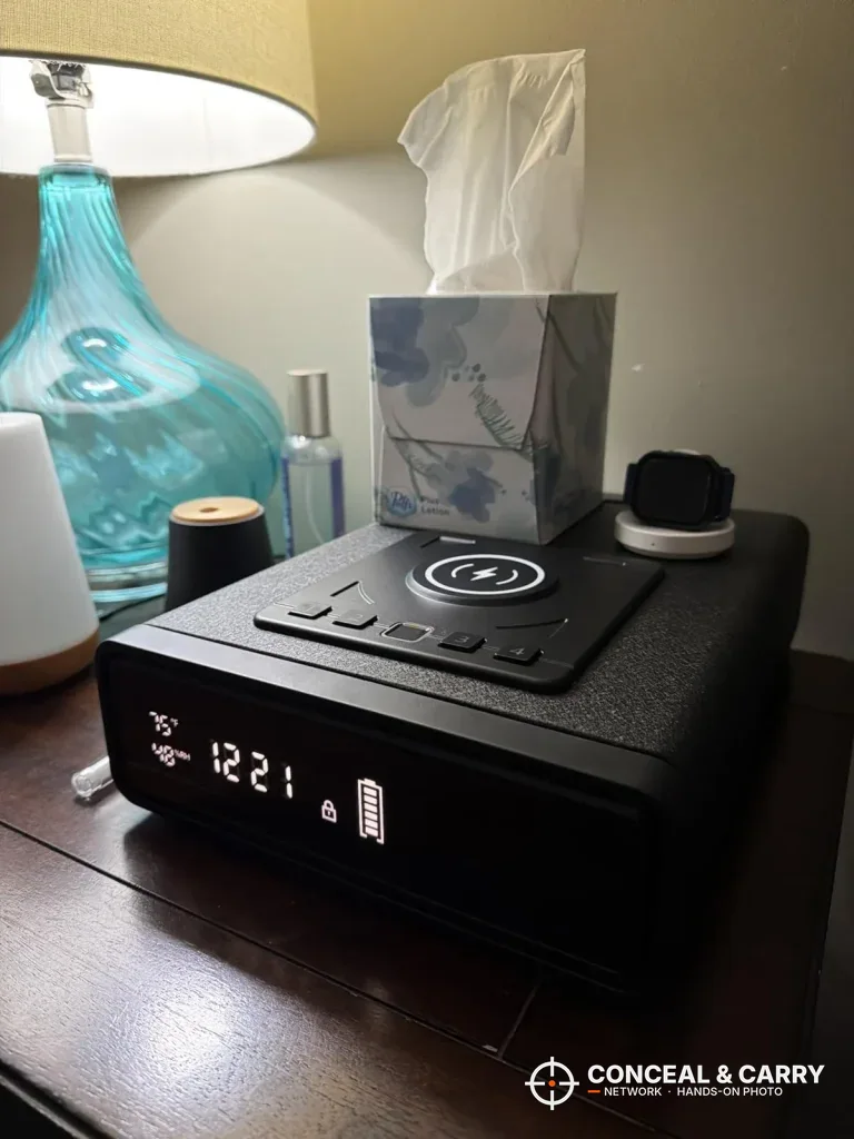 ORARAER safe on a nightstand beside a lamp and a tissue box