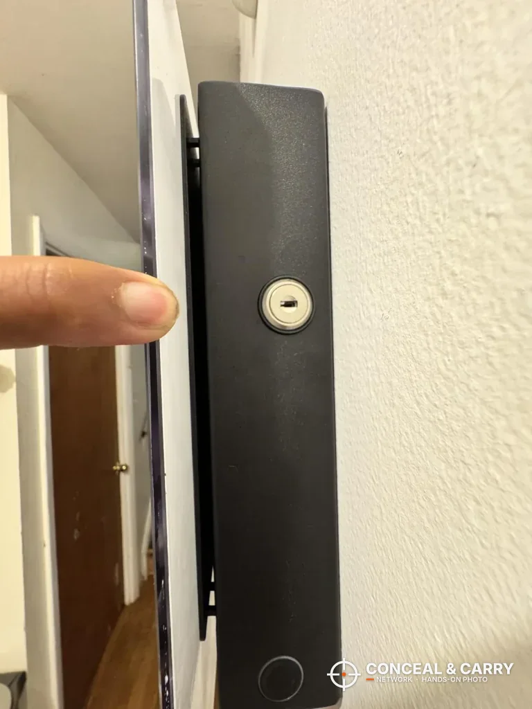 Side profile of the PJJSZST safe hung on a wall, showing how thin it sits