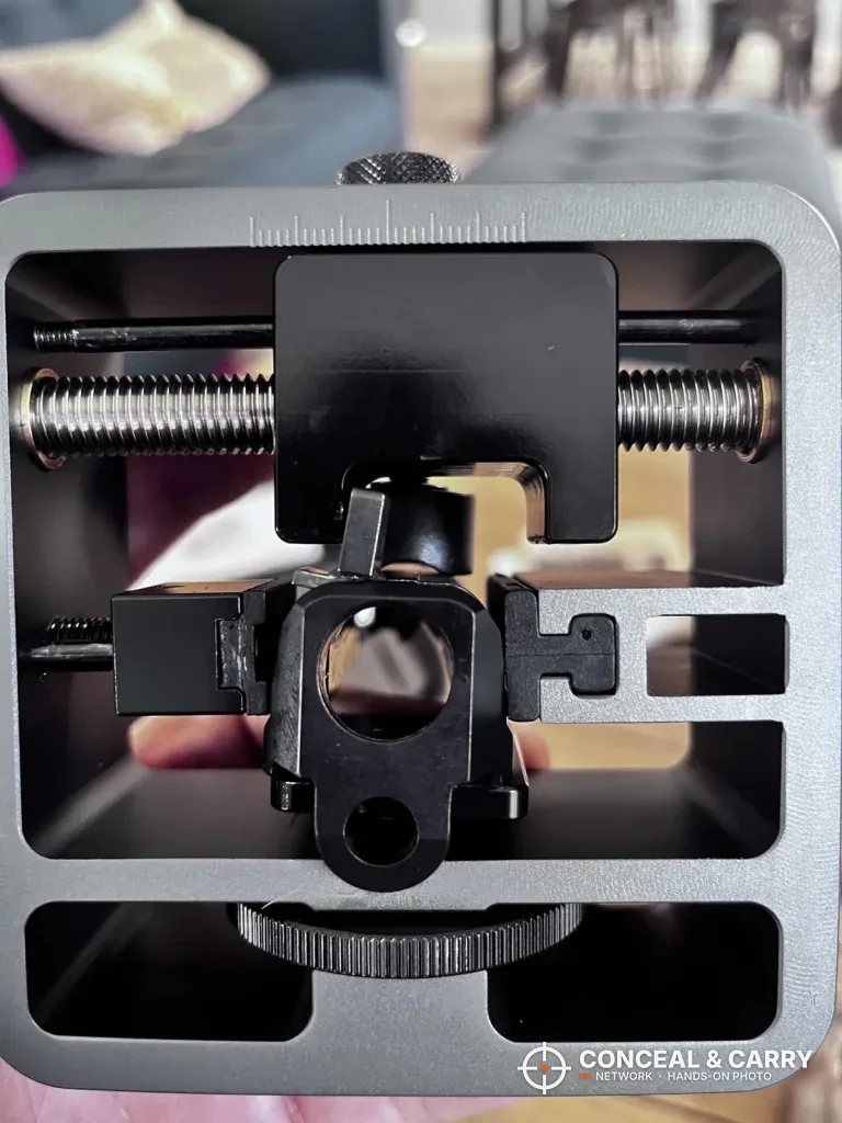 Straight-on view through the Pridefend sight pusher frame showing the push block