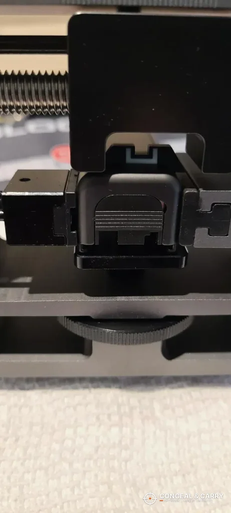 Glock rear sight centered under the Pridefend sight pusher push block
