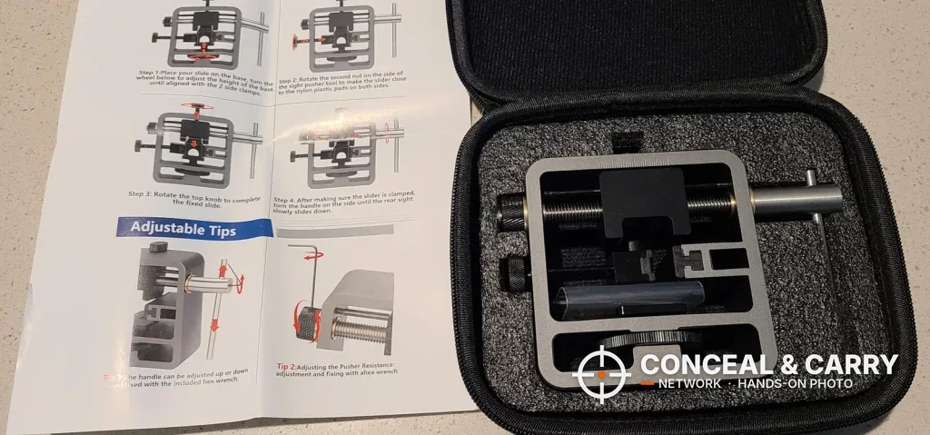 Pridefend Glock sight pusher in its foam-lined zippered case beside the instruction booklet