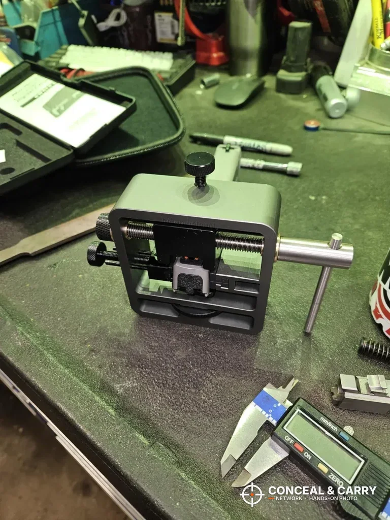 Front view of the Pridefend sight pusher on the bench with the T-handle to the side