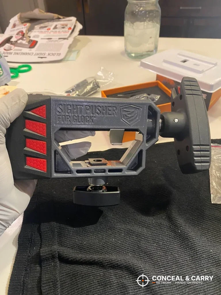 Front view of the Real Avid Glock sight pusher frame and clamp knob