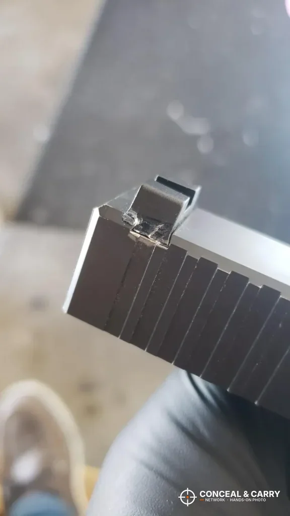 Close-up of a Glock rear sight, where Real Avid sight pusher shoe marks would show