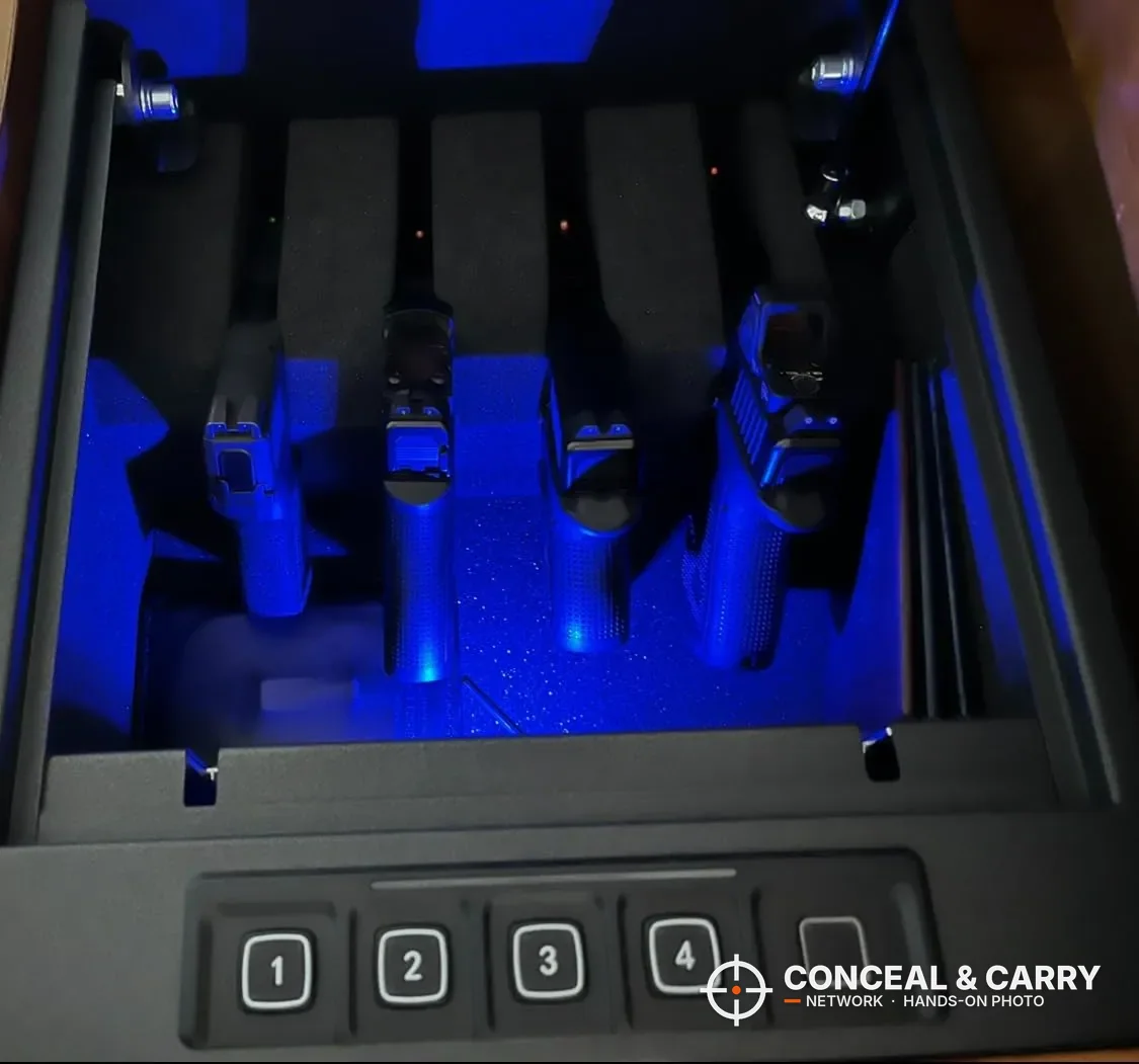 RPNB 4-pistol biometric safe open with four pistols in the blue-lit foam rack