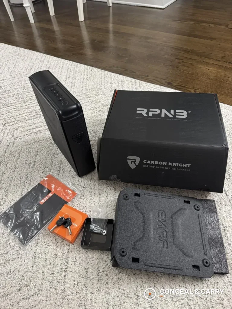 RPNB bedside safe unboxed with its retail box, mounting bracket, keys and hardware