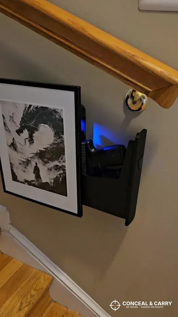 RPNB bedside safe mounted on a wall by a staircase with the drawer open
