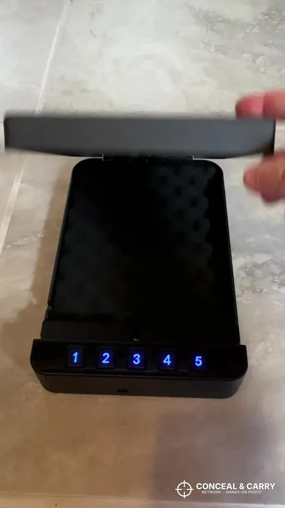 RPNB portable car gun safe lid lifting open with the keypad lit blue