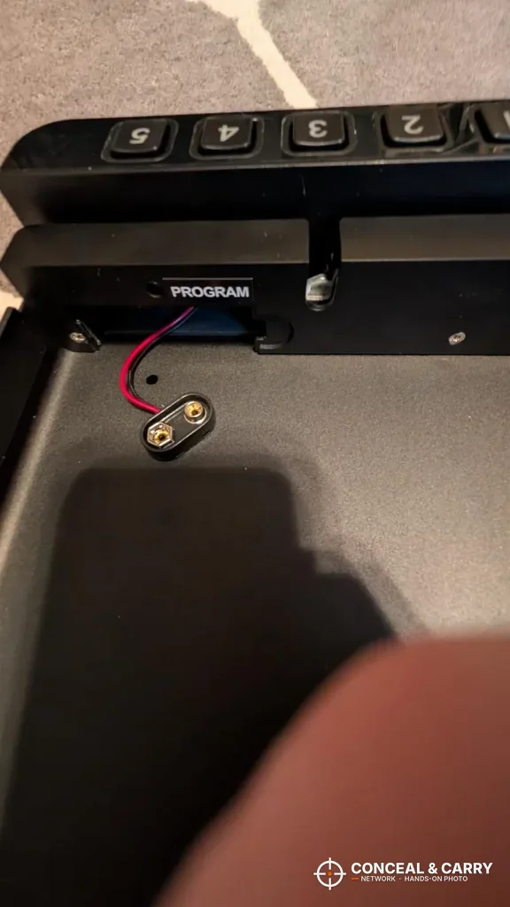 Battery clip inside the RPNB portable car gun safe behind the keypad