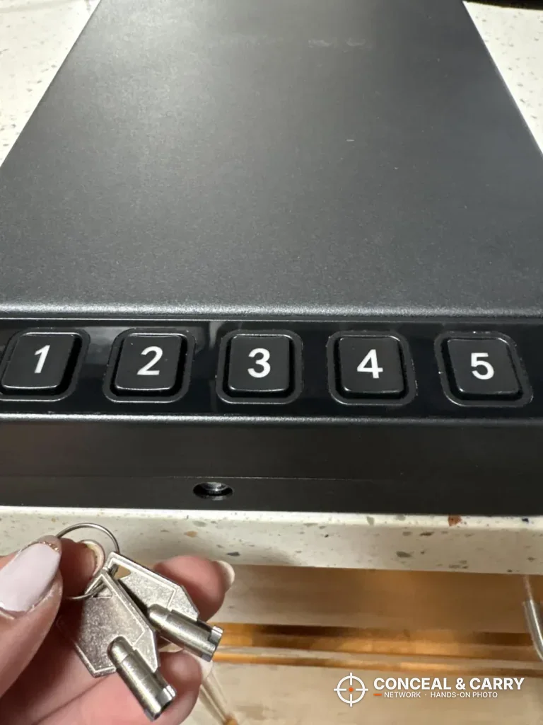 Two backup keys held below the RPNB car gun safe keypad and keyhole