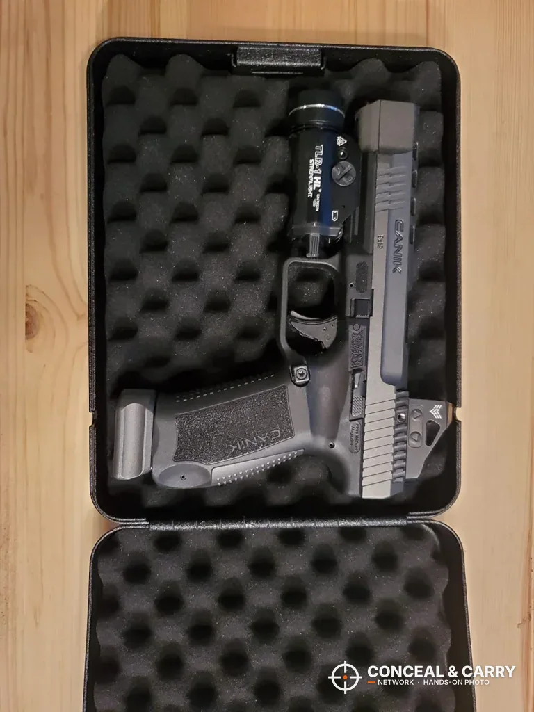 Pistol lying flat in the foam inside the RPNB portable car gun safe