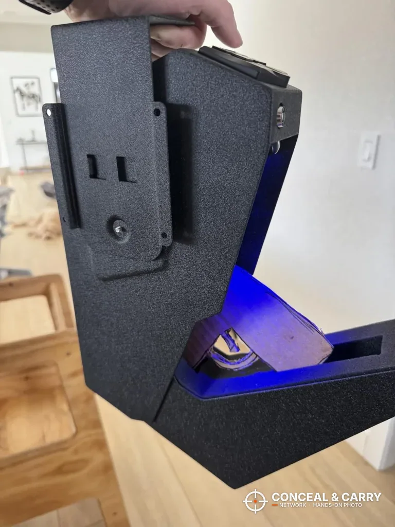RPNB wall-mounted pistol safe held by its top with the drawer swung open