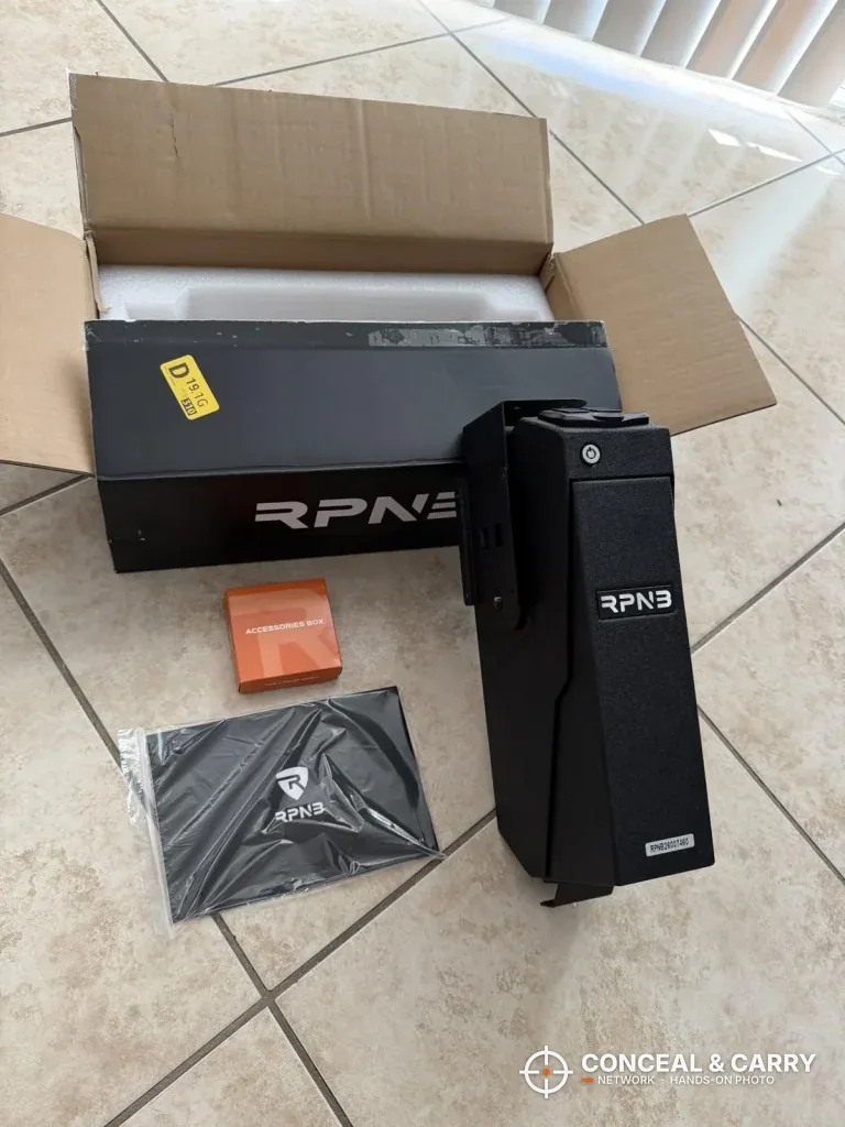 RPNB wall-mounted pistol safe standing next to its open carton
