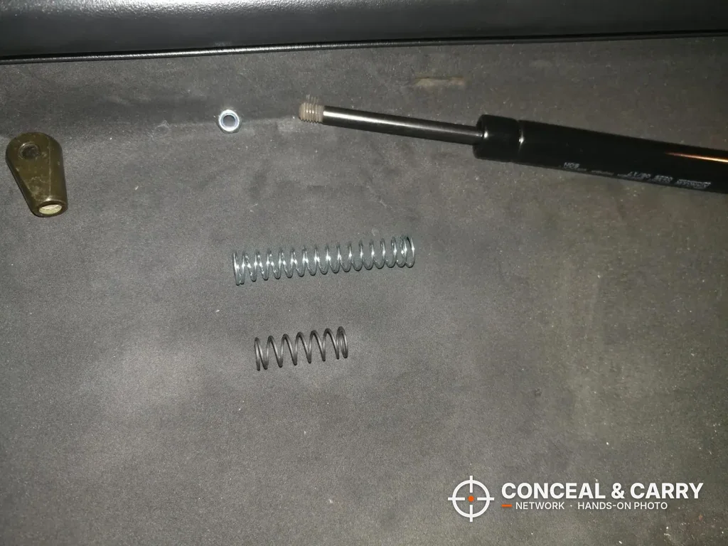 SentrySafe QAP2E gas strut and two coil springs out of the safe