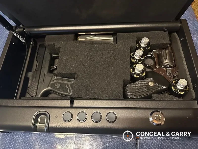 Pistol, revolver and speed loaders in a foam insert inside the SentrySafe QAP2BLX
