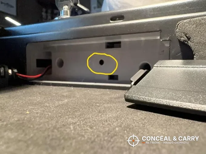 Hole circled in yellow on an inside wall of the SentrySafe QAP2BLX