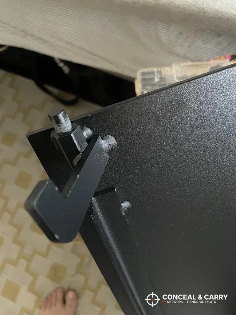 Close-up of the hardware on the edge of the SnapSafe in-wall safe door