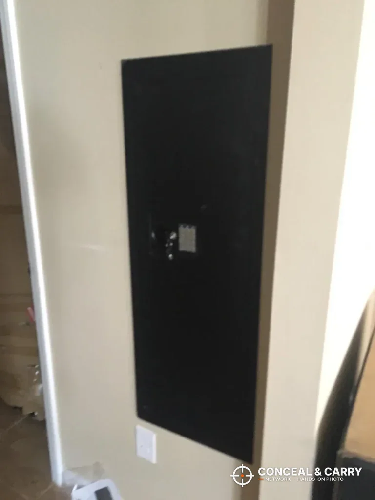 SnapSafe in-wall long gun safe closed in a wall next to a corner