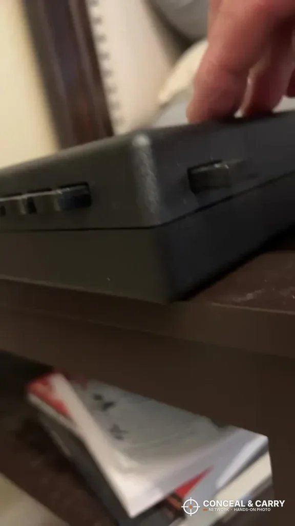 Hand resting on top of the StopBox USA on a shelf