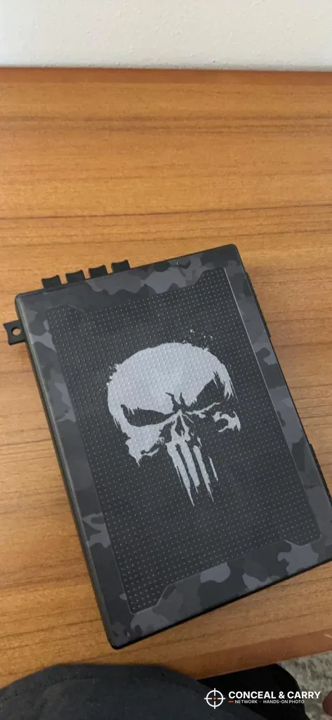 Skull-pattern StopBox USA lying on a wooden table