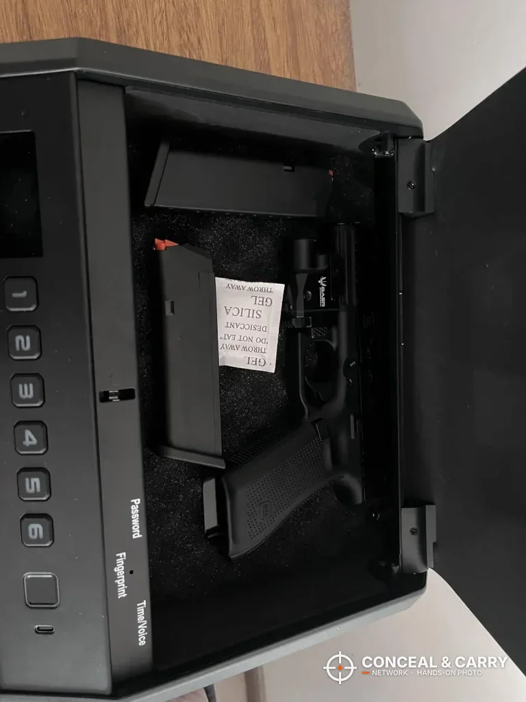 Pistol and magazine inside the open TOPMEDA biometric safe