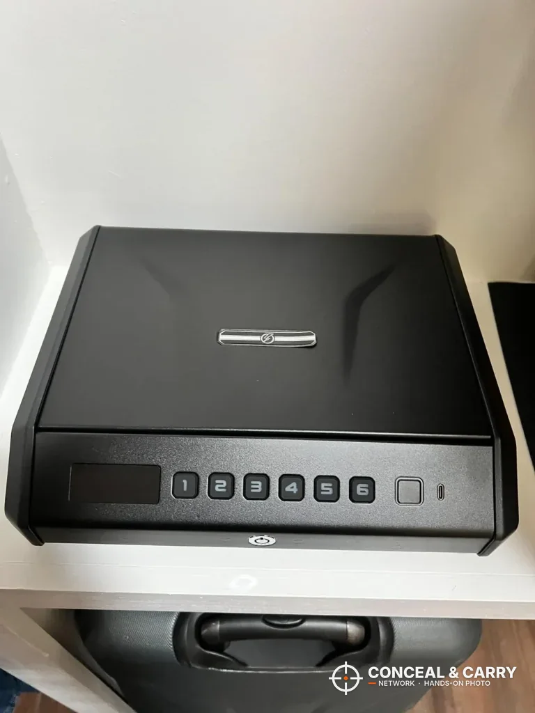 TOPMEDA pistol safe from above showing the lid badge and front keypad
