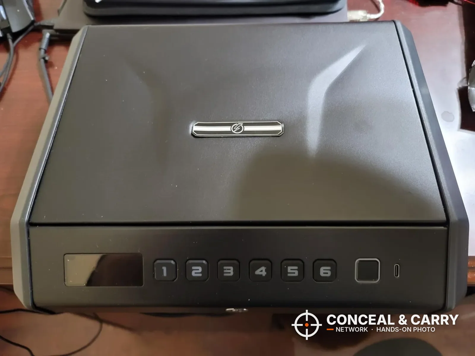 TOPMEDA large biometric pistol safe closed, front view with LCD and keypad