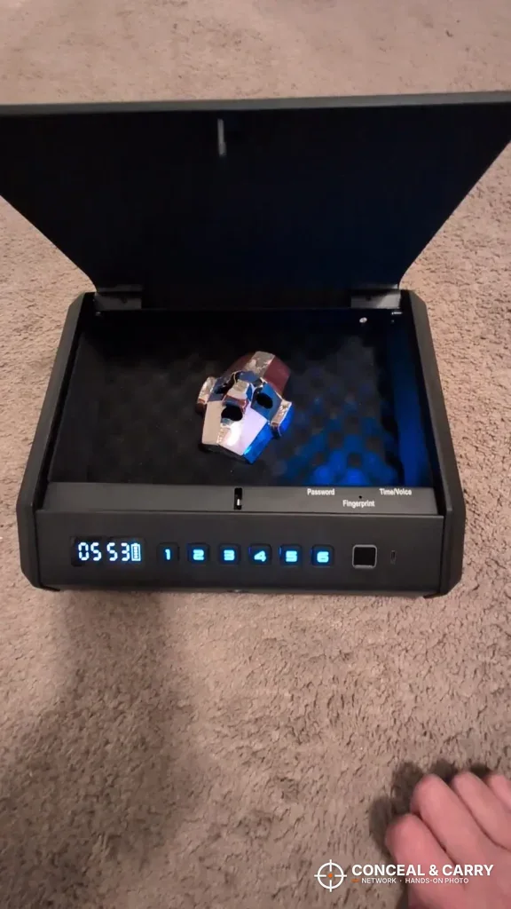TOPMEDA safe open on a carpeted floor with the interior light on