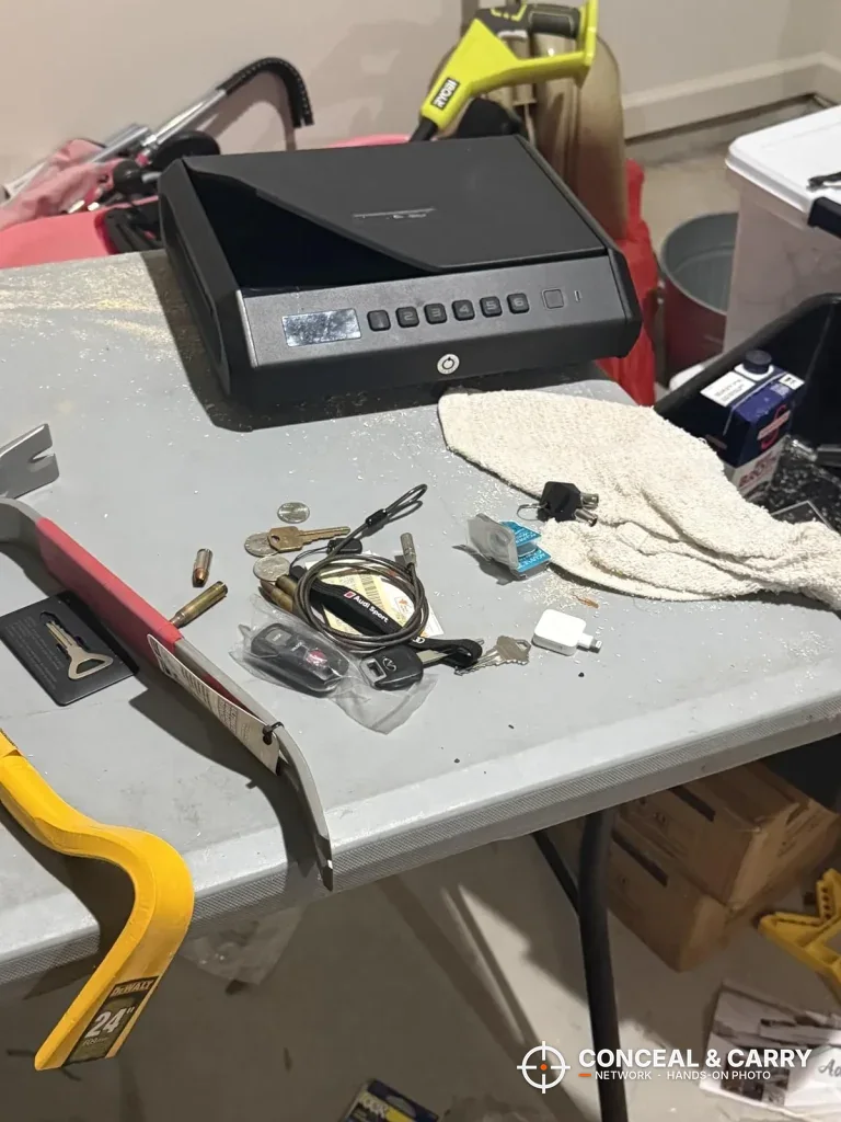 TOPMEDA pistol safe on a workbench beside hand tools