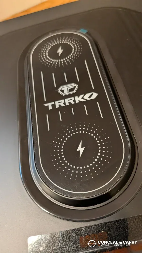 Dual wireless charging pad with the TRRKO logo on top of the safe