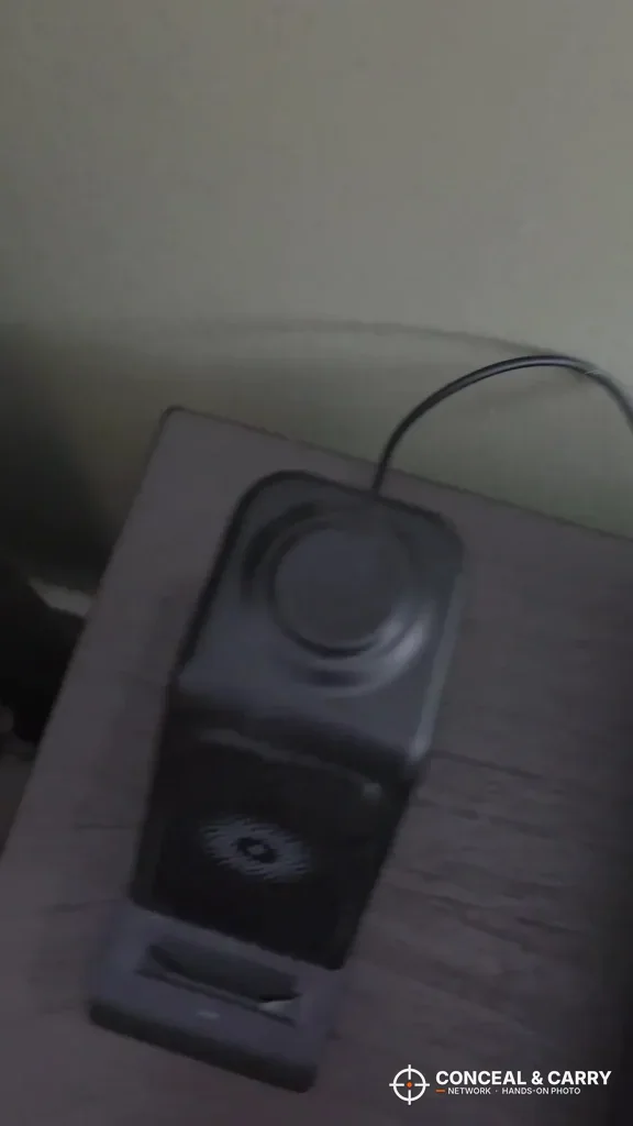 Low-light view of the TRRKO safe on a nightstand with its power cord attached