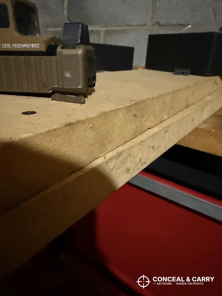 Tan slide on the workbench edge before clamping in the TRUGLO sight tool
